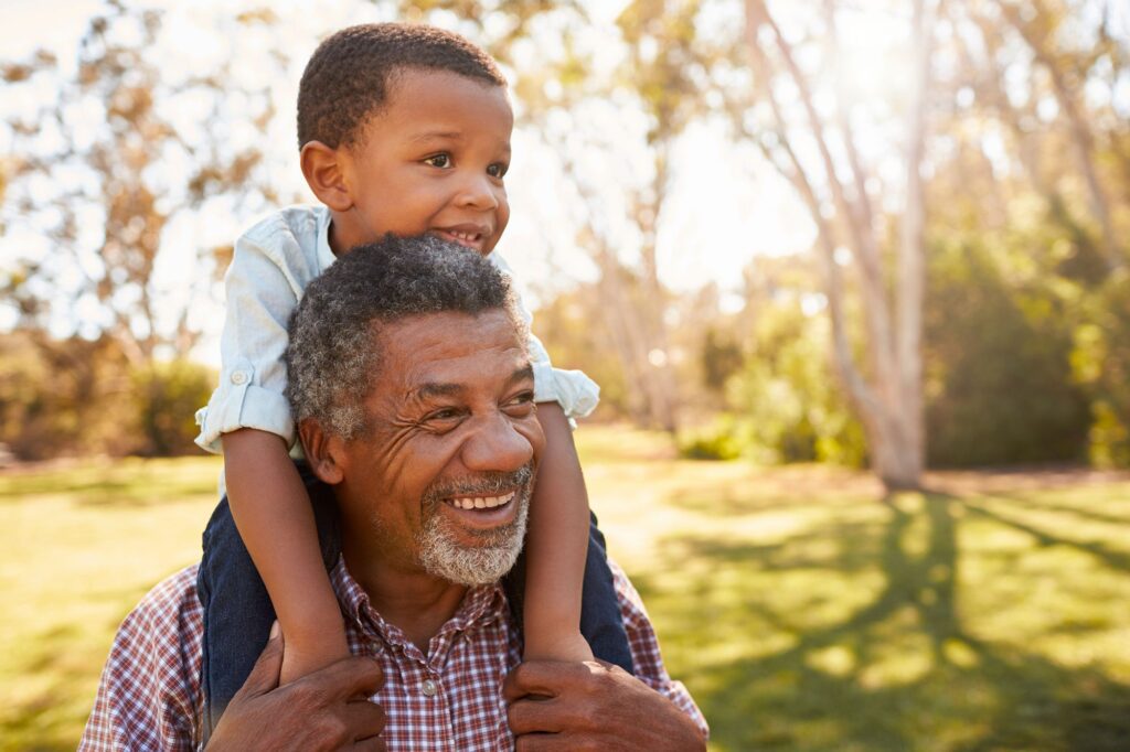Grandfather and grandson having fun with freedom in retirement