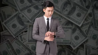Young aspiring Los Angeles realtor looking at watch for time