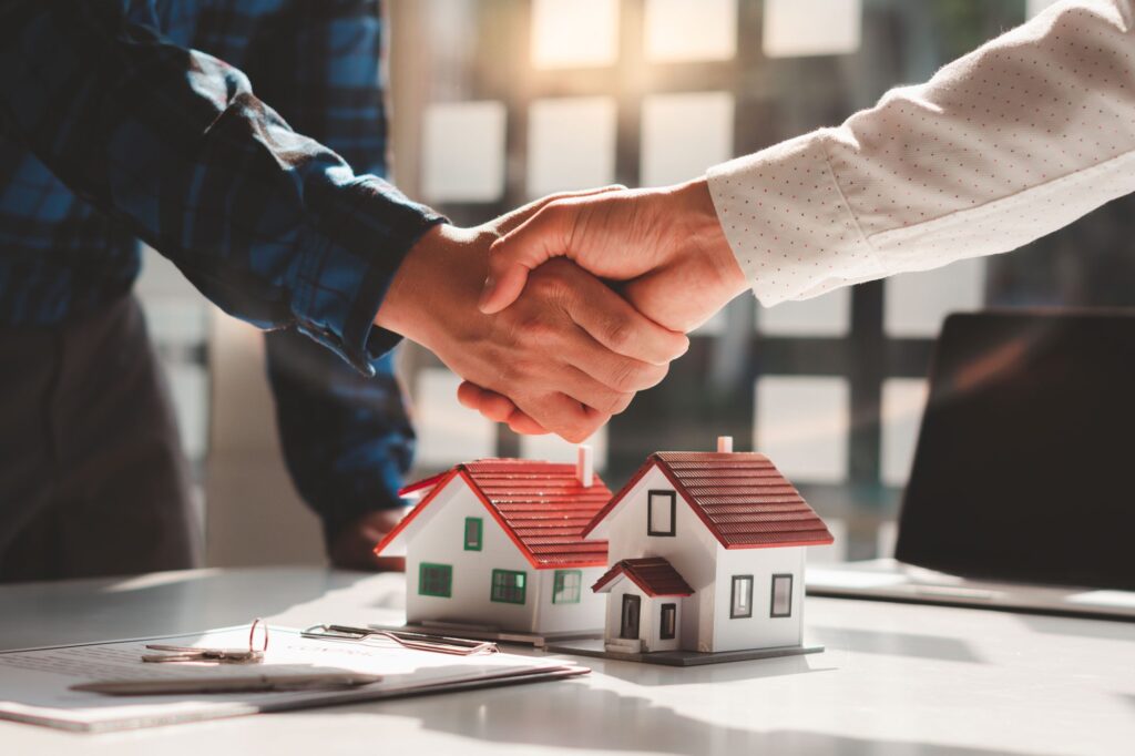 Osborne homes shaking hands with a realtor partner in Los Angeles office