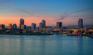 Long Beach, California in the sunset taken from the water looking in on the city of Long Beach.