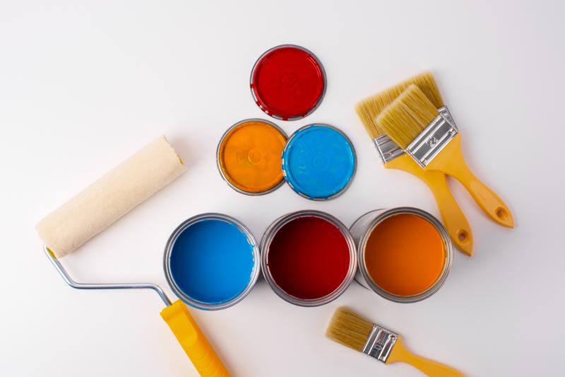 Open paint cans and brushes showing lead paint color concerns