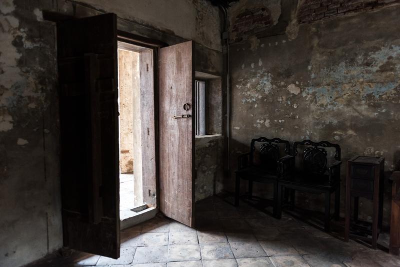 Interior of old deteriorating house showing signs of structural neglect and decay