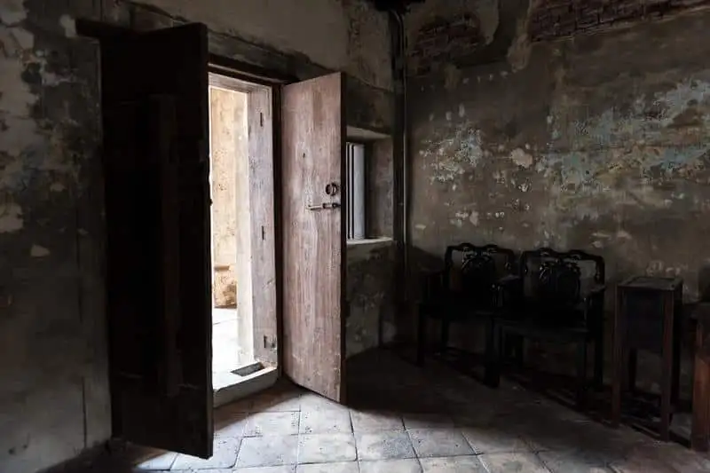 Interior of old deteriorating house showing signs of structural neglect and decay