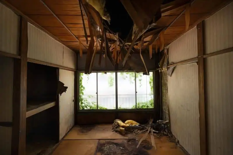 Interior ceiling collapse and decay showing what happens in condemned houses