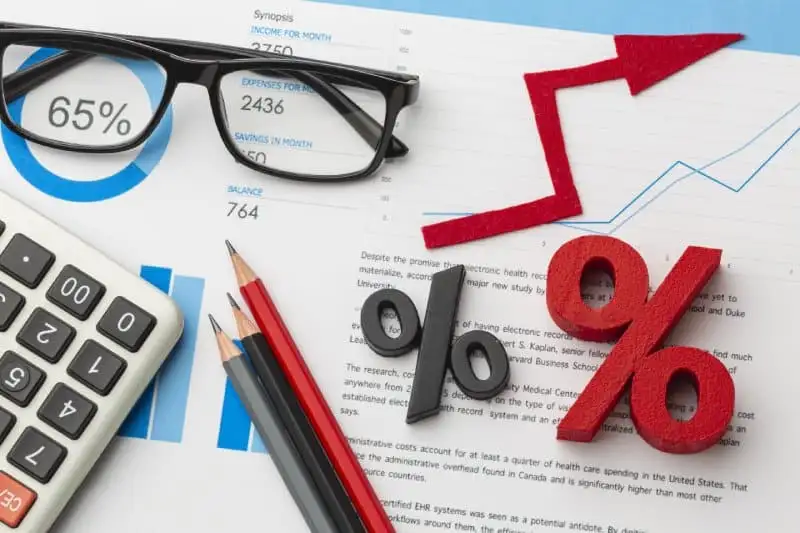 Financial chart with percentage symbols and calculator showing tax increase.