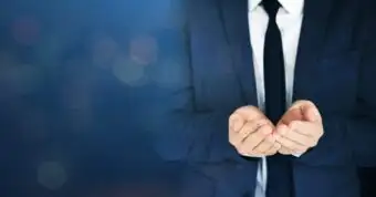 Businessman in suit presenting open hands, asking for a commission.