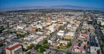 Aerial view of Bakersfield, California. We buy houses in Bakersfield, CA!