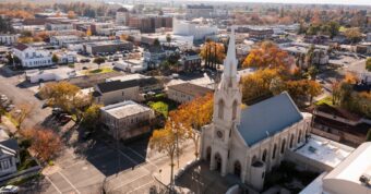 Aerial view of Marysville in Yuba County with historic church, highlighting Osborne Homes’ buying area.