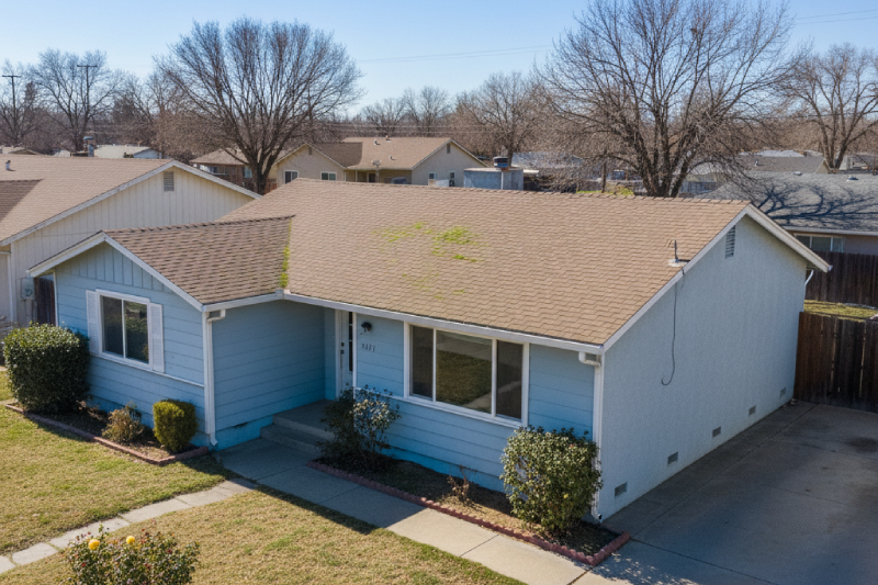 Single-story ranch home in Stanislaus County requiring repairs purchased as-is by cash home buyers. AI-generated.