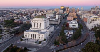 Oakland downtown skyline showing Alameda County urban areas where cash home buyers purchase properties quickly.