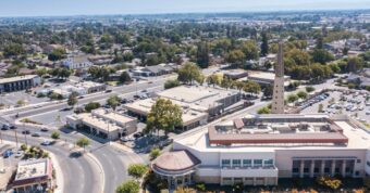 Aerial view of Turlock, California, downtown area showing Stanislaus County real estate market for cash buyers
